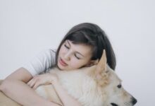 woman hugging a dog