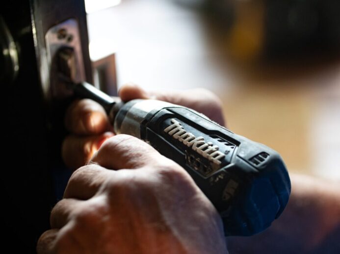 selective focus photography blue and black Makita power drill